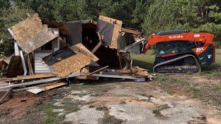 Kubota svl 97-2 ramming a house !!