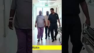 Patient walking after lumbar TLIF surgery (spinal fixation surgery)