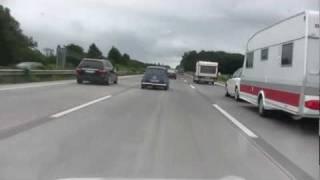 Mini Cooper and Goggomobil together on highway