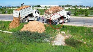 Excellent !! Just starting new Project Landfilling up dump truck unloading stone by Dozer D21P