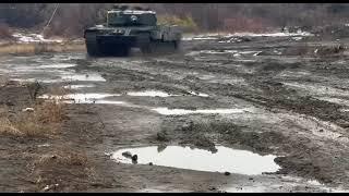 Russian Soldiers driving a Captured Leopard 2A4 tank