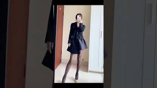 Sexy girl change dress in front of mirror. beauty legs, high heel shoes and mini skirt, cross dress