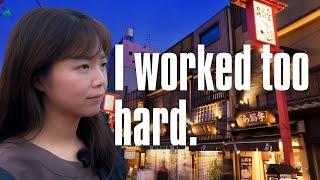 Super tired: A Japanese woman walking in Tokyo at night on her first holiday in a month.