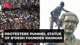 Bangladesh unrest: Angry protesters loot PM's palace, pummel statue of founder Mujibur Rahman