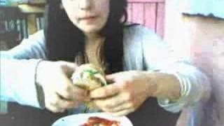 starving woman in India eating at a diner.