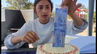 Rich man gives cake filled with money to a student to help her support her family