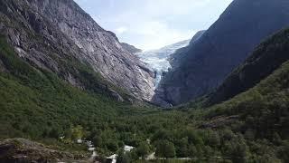 Kleivafossen waterfall and Briksdalbreen Glacier in Jostedalsbreen National Park, Norway