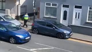 moment man leaps from roof of two-storey building 'in bid to get away from police'