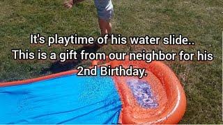 Summer is here..It's his water slide playtime.This is a gift from our neighbor for his 2nd Birthday.