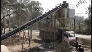 Efficient mixing by pug mill unit of wet mix macadam plant