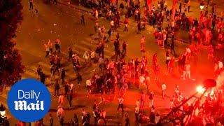 Rowdy fans throw debris at police in Paris after France win