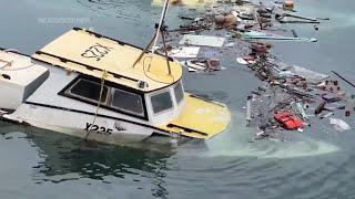 Fishermen in Barbados assess the damage to their boats from Hurricane Beryl