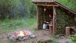 Building a Summer Shelter of Pine Branches. Stone Outdoor Fire Pit . Harvest Birch juice