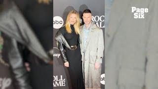 Behati Prinsloo awkwardly grabs Adam Levine’s hand on red carpet a year after cheating scandal