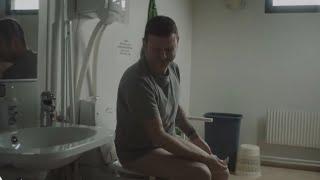 man taking a strong poop and wipping butt with the shirt