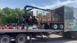 Rollback unloading a Log Loader trailer