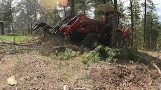 TYM 574 HST Root Grapple tearing out trees