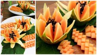 Beautiful fruit carving and cutting a flower with papaya