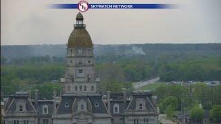 Jesse Walker spots housefire from tower cam at start of WAWV News at 5