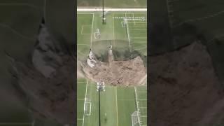 Sinkhole swallows light pole and leaves huge hole in Illinois soccer field | #sinkhole #illinois
