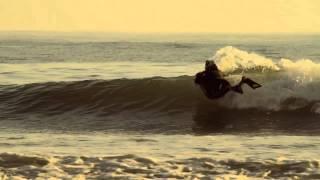 Andrew Stephen Buck on a surf mat