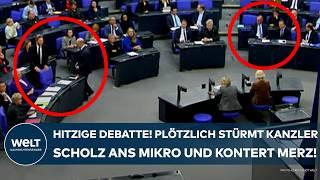 BUNDESTAG: Hitzige Debatte! Plötzlich stürmt Kanzler Olaf Scholz zum Mikro - und kontert Merz