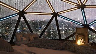 Cool bedroom surrounded by windows on a rainy day