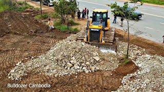 Full Processing Shantui Dozer Pushing Gravel And Heavy Dump Truck Unloading Gravel