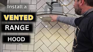 Install a hood vented range hood on tile wall