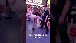 Kick him in the nuts!