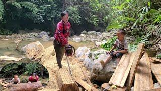 Hoang and Phong went to cut wood to build the kitchen.