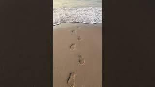 Sea waves  washed away sand foot prints  #seabeach #seawaves #beachcamping #footprints