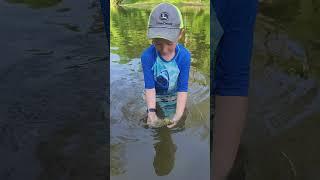 releasing his catch. #homesteaders #youngfarmer #fishing #youngfisher