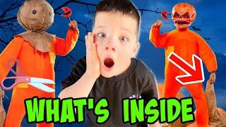 WHATS INSIDE SAM'S BAG! CUTTING OPEN TRicK OR TREAT SAM with AUBREY and CALEB  !