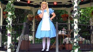 Alice from Alice in Wonderland Distanced Character Interaction at Epcot, United Kingdom Pavilion