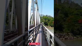 Riding a motorbike along the narrowest path on a railway bridge. Nha Trang, Vietnam. #shorts