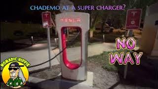 Nissan Leaf at a Tesla supercharger with adapter no magic dock