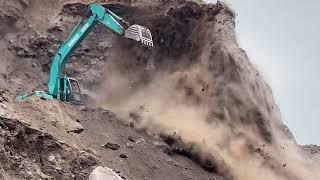 Sand mining,Cutting cliffs with a Kobelco SK 200 excavator in a sand mine