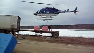 Unloading semi-truck with helicopter