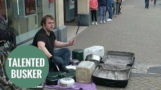 Amazing busker who plays the drums with old kitchen utensils.