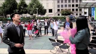 Man propose to his girl friend at San Francisco Union Square during a live band event