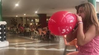 Popping balloons in public