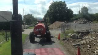 Ford 7610  following Case With Abbey 1100 Gallon Slurry Tanker