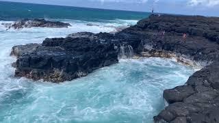 Kid swimming to survive scary wave Queen's Bath Kauai, Hawaii