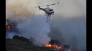 BELL205 HUEY SIERRA LIMA KILO FIGHTING FIRES AT TABLE MOUNTAIN.