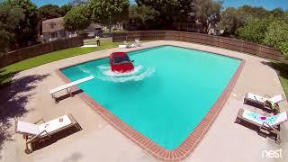 Car Rolls Off Flatbed Tow Truck Into Pool