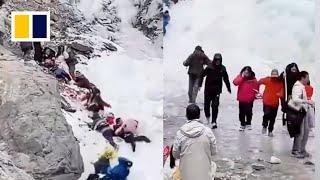 Massive icicles fall on tourists at popular waterfall in China, injuring 1