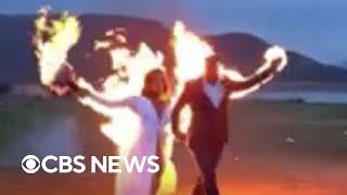 Stunt couple intentionally set themselves on fire while walking down the aisle