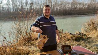 Чахохбили из утки в казане на природе. Duck chakhokhbili in a cauldron outdoors.