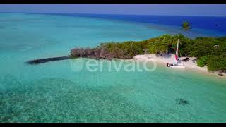 Aerial flying over travel of beautiful resort beach voyage by blue green ocean and white sand ba...